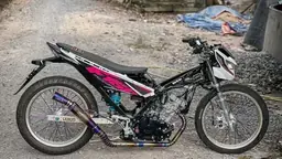 Modified underbone drag bike parked on a village road
