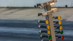 Drag racing christmas tree starting lights showing staged and amber bulbs
