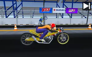 Yellow drag bike staged at the starting line with sponsor banners behind
